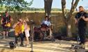 Arielle (Born to be Wild) Balch helps out daddy Doug during The Mercury Agenda show at Windmill Creek. photo by BB Huey
